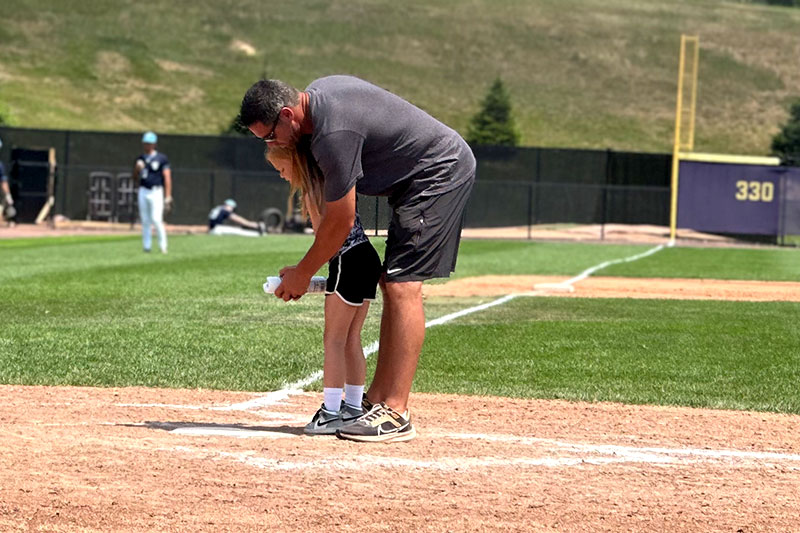 Coach & Daughter Line The Field